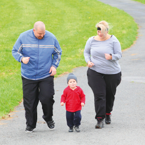 obese family running